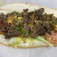 Phillie cheese steak Hero · served with onions, peppers, and melted cheese