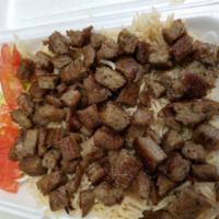 Lamb Over Rice · Lamb Gyro Over Rice Platter with lettuce and tomatoes and side of white sauce