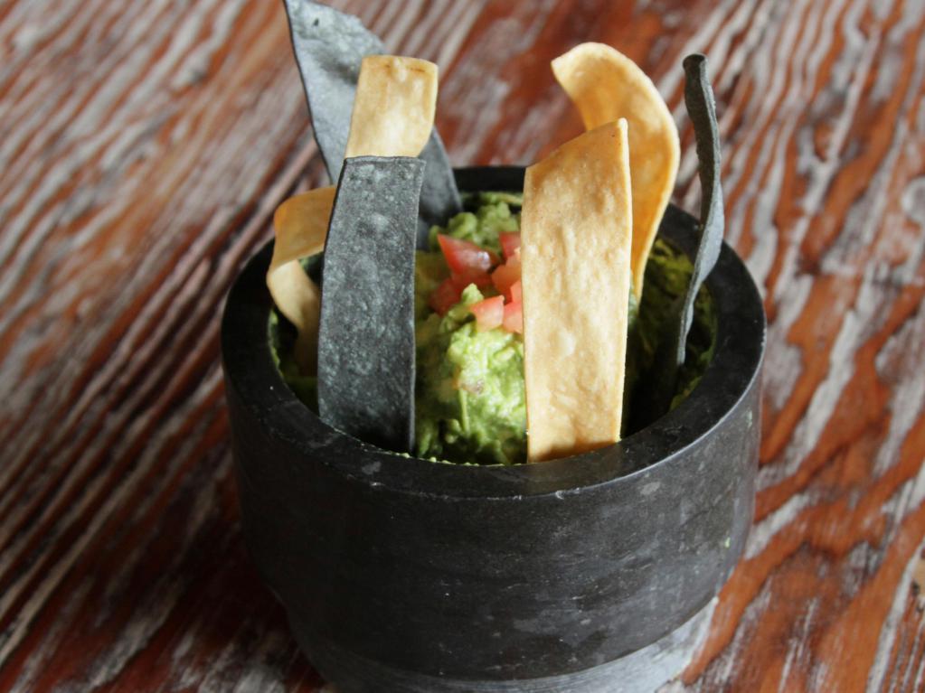 Homemade Guacamole · With homemade corn chips.