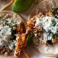 3 Piece Tinga Tacos · Shredded chicken with onions and Oaxaca cheese, slow cooked in tomato and chipotle sauce.