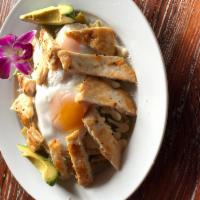 Chilaquiles Verdes · Corn tortilla lightly fried with chicken in tomatillo green sauce. Garnished with onions, Me...