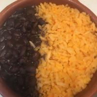 Arroz y frijoles · Mexican yellow rice with Mexican black beans 