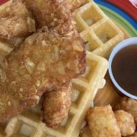 Chicken And Waffles · Crispy chicken strips, apple waffles, hot sauce, caramel apple maple syrup. 