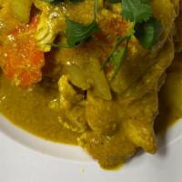 Yellow Curry and Rice · Carrot, onion, potato, coconut curry sauce, cilantro.