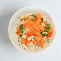 Bahn Mi Salmon Bowl · Salmon, pickled carrot, pickled daikon, salted cucumber, sesame seeds, cilantro, sesame sush...