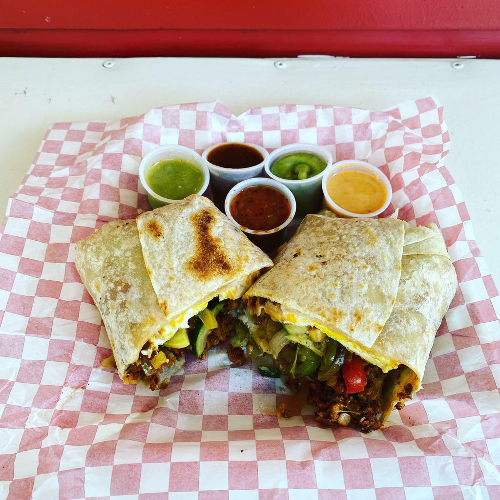 Breakfast Burrito · Choice of meat or vegetarian with scrambled eggs, potatoes, sour cream and cheese wrapped in a flour tortilla.