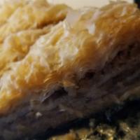 Baklava · Classic Greek style. Flaky and filled with walnuts & drizzled with honey