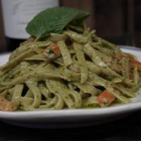 FETUCCINE AL PESTO · Fetuccine Tossed with Pesto. Green Peas and a Light Cream and Parmesan Sauce.