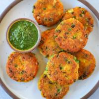 Aloo Tikka Tok · Patties of spiced potatoes stuffed with spicy lentils.
