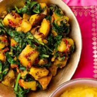 Saag Aloo Saagwala · Potatoes, spinach cooked together with spiced, and tomatoes.
