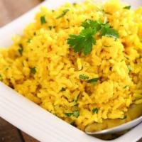 Yellow Rice  · Lemon flavored basmati rice with curry leaves and mustard seeds.
