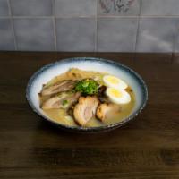 Roast Pork Ramen · Wavy noodle in our homemade soup topped with scallion, bean sprouts, cabbage, corn, and boil...