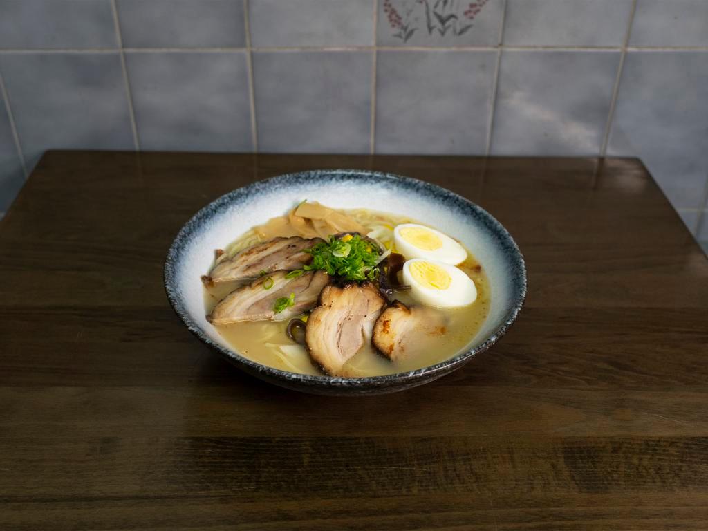 Roast Pork Ramen · Wavy noodle in our homemade soup topped with scallion, bean sprouts, cabbage, corn, and boiled egg.