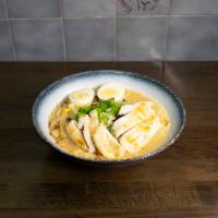Chicken Ramen · Wavy noodle in our homemade soup topped with scallion, bean sprouts, cabbage, corn, and half...