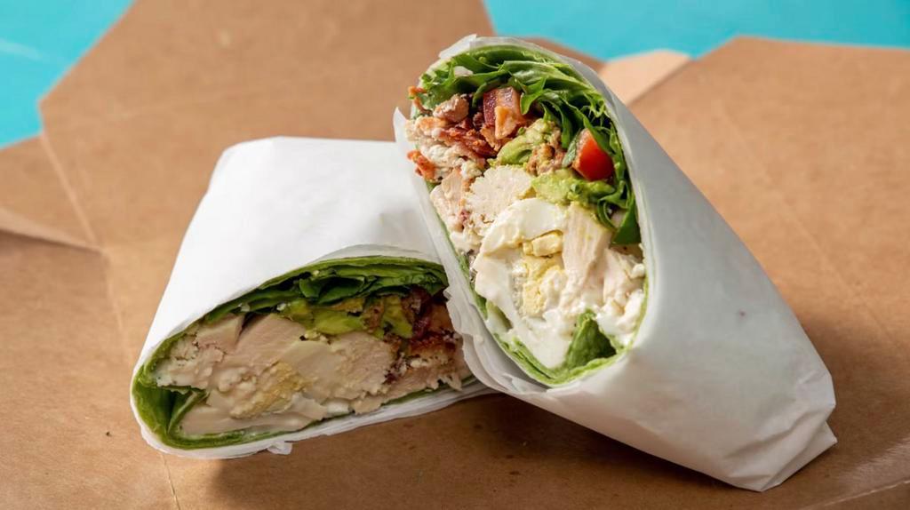 Chicken Cobb Wrap · Hero greens, tomato, bacon, avocado, blue cheese crumble, grilled chicken, and egg.