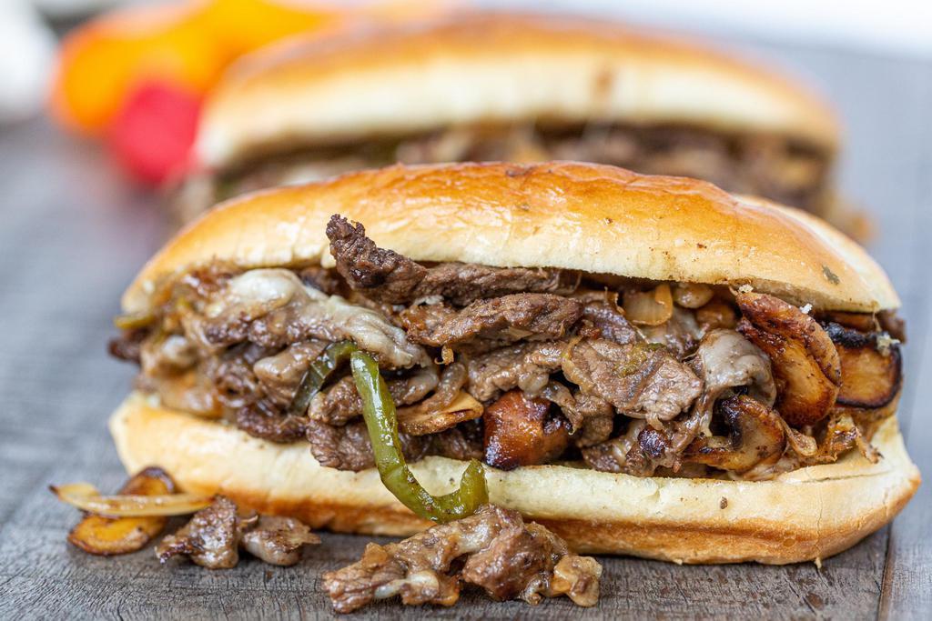 Philly Cheese Steak  · Onion, bell pepper with 1 side.
