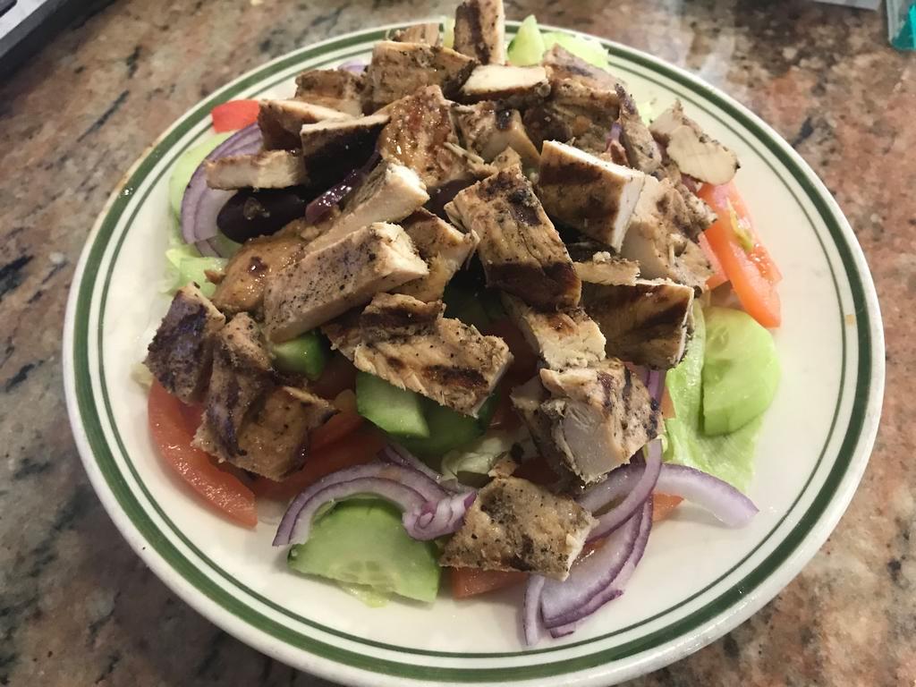 Mariella Grilled Chicken Salad · Lettuce, tomato, onion, cucumber and olives, topped with diced grilled chicken and house dressing.