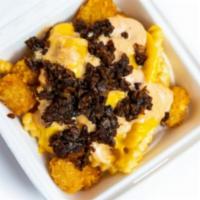 Fat Fries · Fry/tot combo, melted cheese, fat sauce (contains shellfish) and caramelized onions.