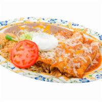 Enchiladas Rojas Plate · Comes with choice of protein, rice and beans.