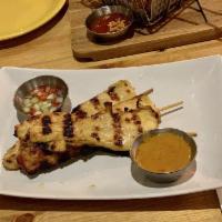 A13. Chicken Satay · Grilled marinated chicken skewers with peanut sauce and cucumber sauce.