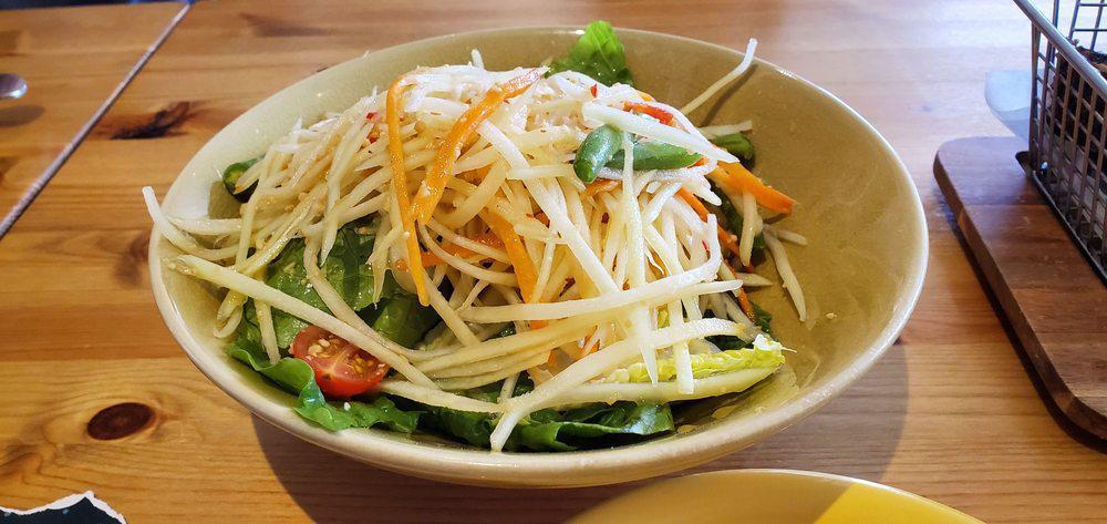S6. Papaya Salad · Green papaya, carrot, cherry tomato, string bean and roasted peanut in chili lime dressing. Spicy. Gluten free.