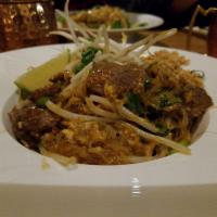 N1. Pad Thai Glass Noodle · Sauteed glass noodle, egg, bean sprout, scallion and crushed peanut. Gluten free.