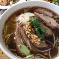 2. Duck Noodle Soup · Rice noodle, crispy duck, Chinese broccoli, bean sprout in herbal broth.
