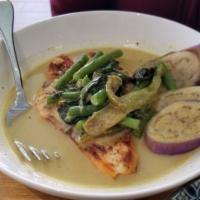 8. Green Salmon · Grilled salmon, bell pepper, string bean, eggplant and basil with green curry. Spicy.