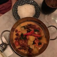 10. Duck Pineapple Curry · Boneless duck, pineapple, bell pepper, cherry tomato and basil in red curry sauce. Spicy.
