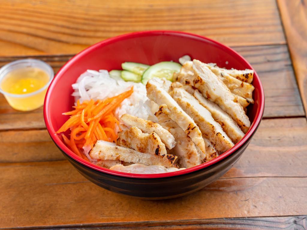 R2. Grilled Chicken Over Rice · Grilled chicken with carrot, cucumber, and white radish on top of white rice