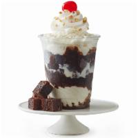 Fudge Brownie Delight Sundae · Vanilla ice cream with a brownie on bottom. Served with fudge, whipped cream, peanuts, and a...
