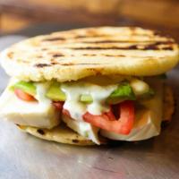 Arepa L'Artista · Avocado, mozzarella hceese, tomatoes, and salsa verde.