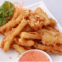 Fried Calamari · Fried calamari strips served with spicy sweet and sour and ground peanuts.