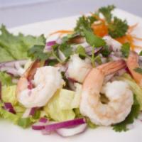 Yum Shrimp Salad · Shrimp, onion, cilantro, lettuce and Thai chili lime dressing.