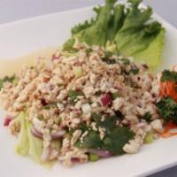 Thai Chicken Salad  · Steamed minced chicken, onion, cilantro, roasted rice powder and Thai chili lime dressing.