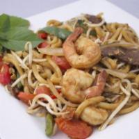 Spicy Udon Noodle · Japanese udon noodle, onions, bell peppers, bean sprouts, tomato, basil leaf and fresh Thai ...