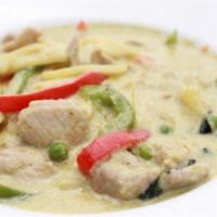 Green Curry · Green chili paste, bamboo shoots, green peas, bell peppers, fresh basil and coconut milk.