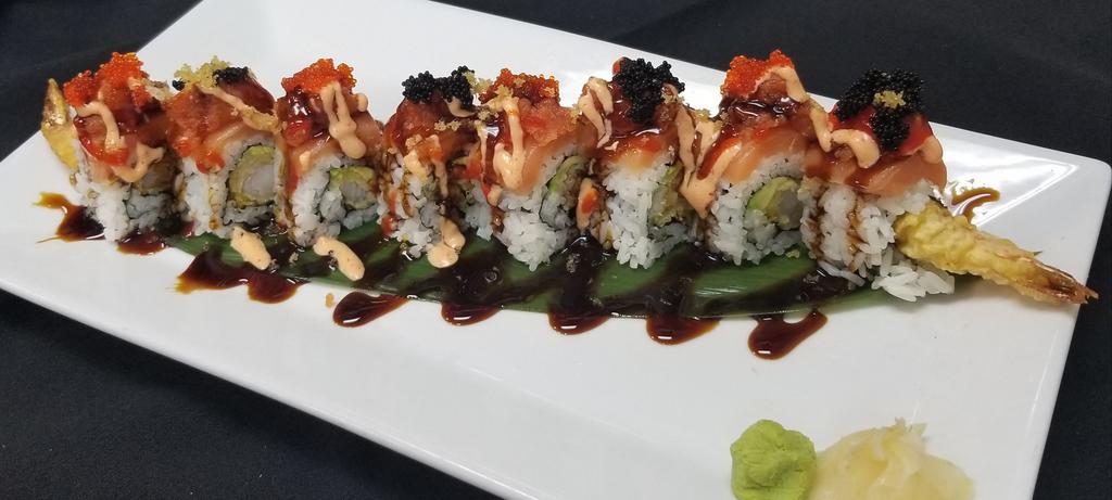 Dream Roll · Shrimp Tempura , Crab Mix , Avocado inside topped with fresh Salmon , Spicy Tuna , Eel sauce , spicy mayo and caviar.
