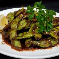SPICY EDAMAME · SAUTEED WITH GARLIC AND SPICY SESAME SOY GARNISH WITH TOGARASHI AND LEMON SLICE