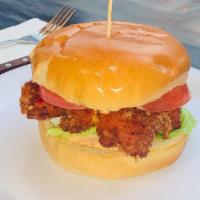 Herbed Mayo Fried Chicken Sandwich · Breaded Chicken Breast on a bun with tomato, lettuce and herbed mayo