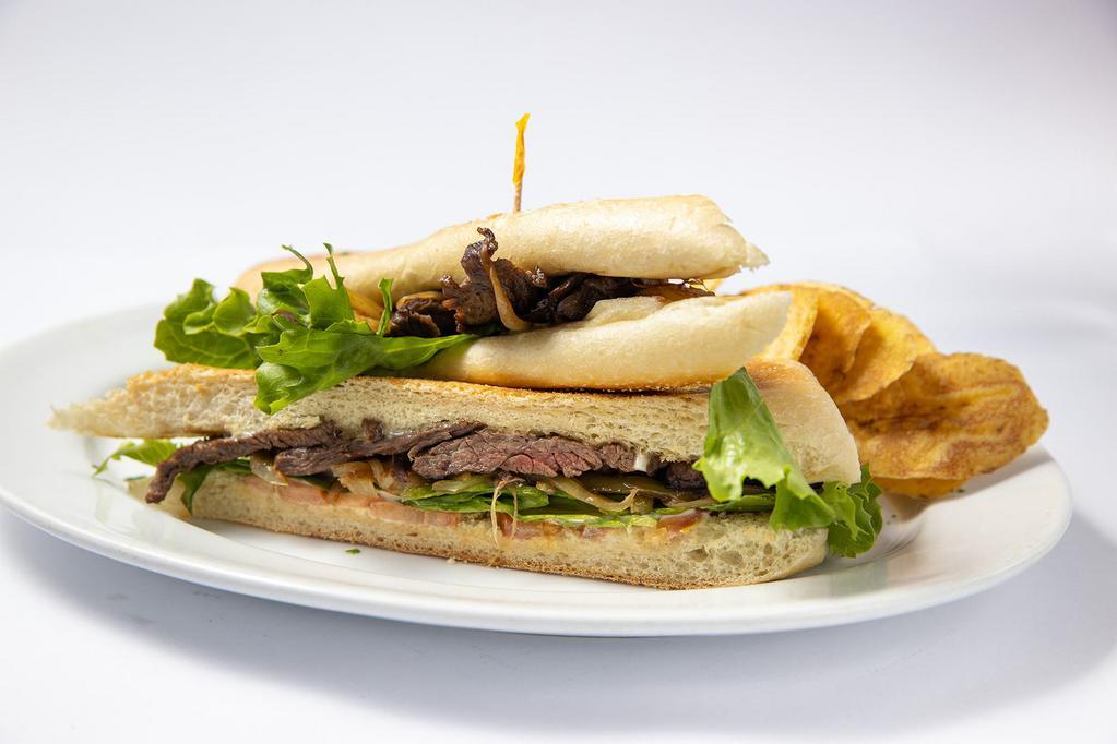 Pan con Bistec Sandwich · Made with Cuban steak sandwich with lettuce, tomatoe and mayonnaise.