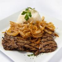 Bistec de Palomilla · Served with traditional thin Cuban steak and sauteed onions.