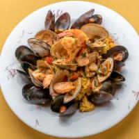 Marinera Paella · Made with Spanish rice, mussels, clams, calamari, bay scallops and shrimp.