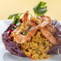 Arroz con Camarones · Comes with yellow rice, shrimp and vegetables.