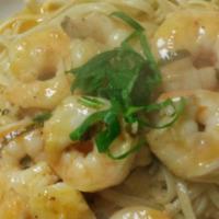 Shrimp Scampi · Large pieces of shrimp smothered in a butter, garlic and wine sauce, and served with freshly...