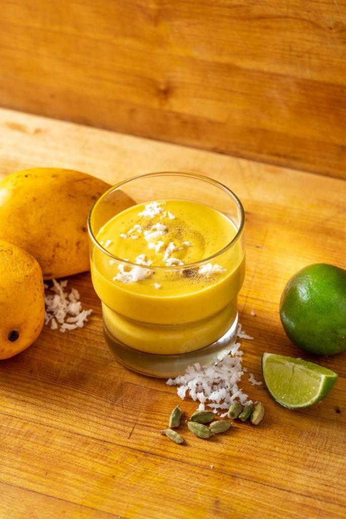 Mango Lassi · Cooling yogurt drink with fresh mango, coconut yogurt, and a dash of cardamom