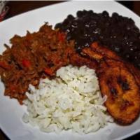 Pabellon Criollo (Venezuelan Food) · Shredded Meat, White Rice, Black Beans, Plantain.