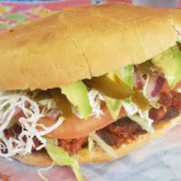 Carne Enchilada  · Spicy pork meat. Prepared with mayonnaise, beans, lettuce, tomato, cheese, onions, avocado a...