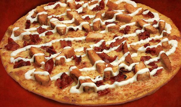Bacon Chicken with Ranch Pizza  · Savory pie with a dough base topped with sauce and cheese.
