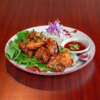 Chicken Wing · Regular, spicy. 5 pieces. Fried chicken wings served with homemade dipping sauce. 